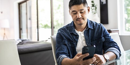 Man using mobile device.